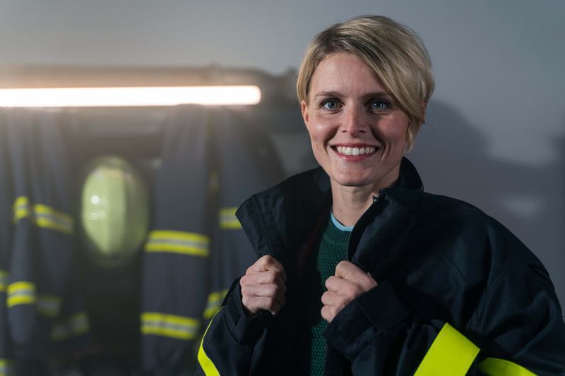 A female firefighter in her uniform
